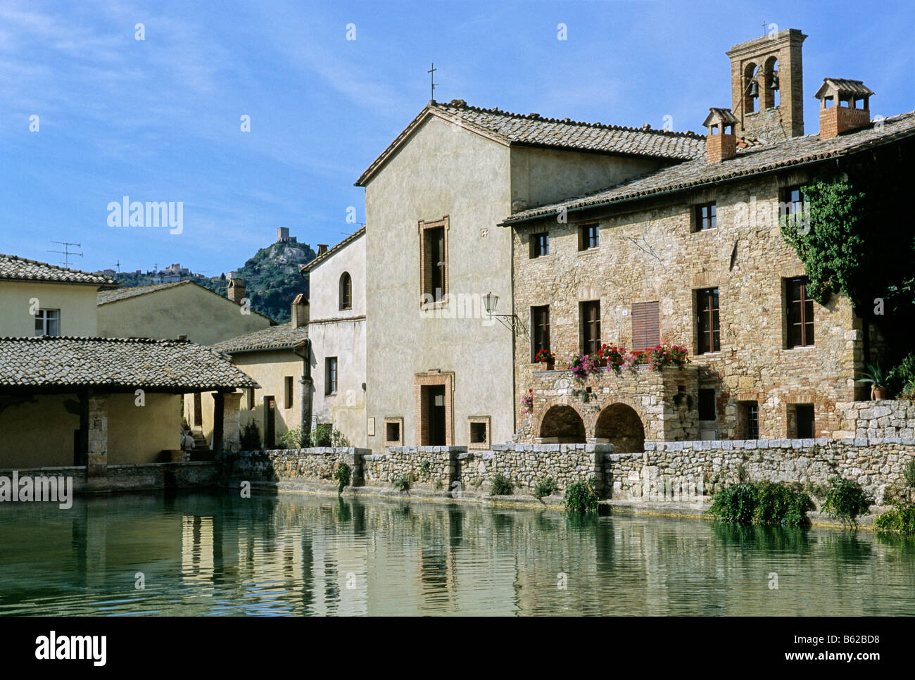 Thermal pool in Bagno Vignoni, at back the Rocca d' Orcia, Siena province, Tuscany, Italy, Europe Stock Photo