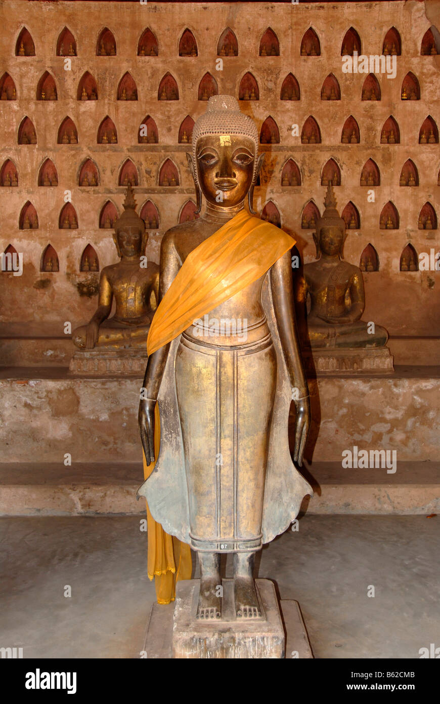 Typically Laotian standing bronze Buddha statue, Wat Sisaket, Vientiane, Laos, South East Asia Stock Photo