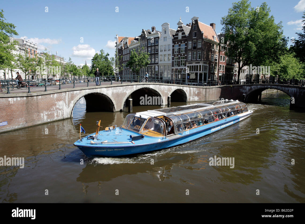 Tourist sightseeing boat on a grachtentour or canal tour, in front of canal houses, Leidse Ecke Prinsengracht, Amsterdam, Nethe Stock Photo