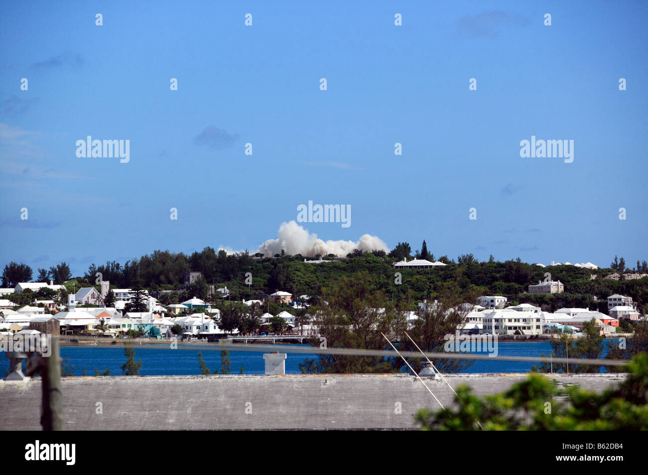 Most of  the former Club Med Hotel has now collapsed and a huge dust cloud is forming. Stock Photo