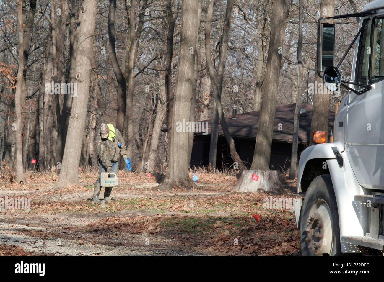 Workman uses electronic sensor to locate pipe Stock Photo