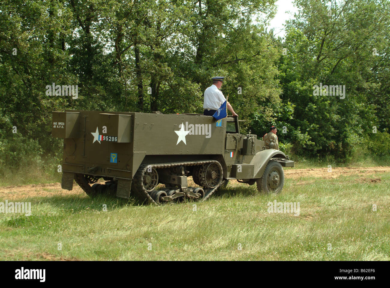 vehicleMBF1921 France American M3 half track with re enactment officer taking salute Stock Photo