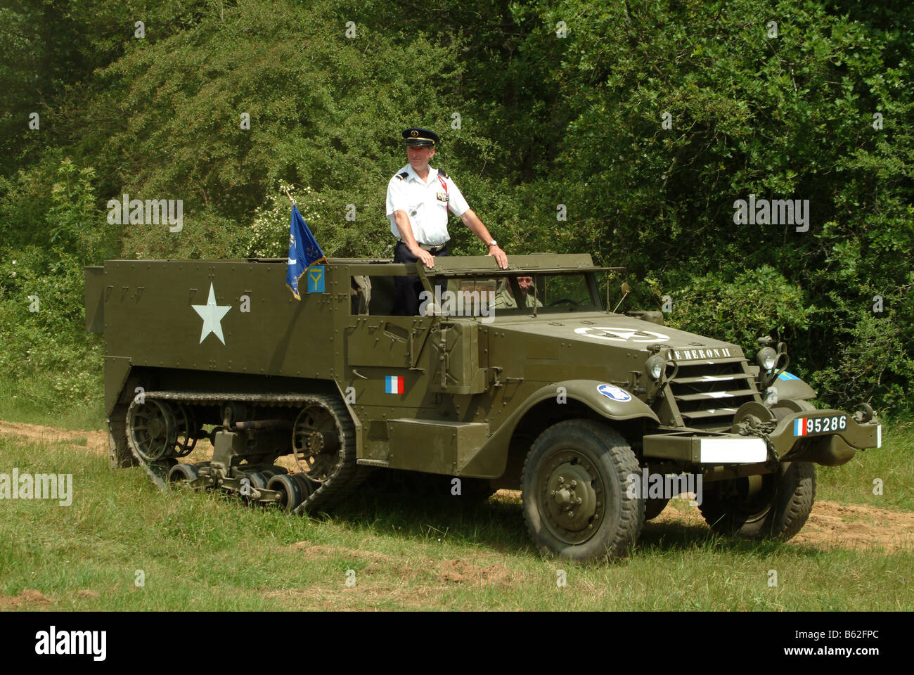 vehicleMBF1920 France American M3 half-track with re enactment officer taking salute Stock Photo