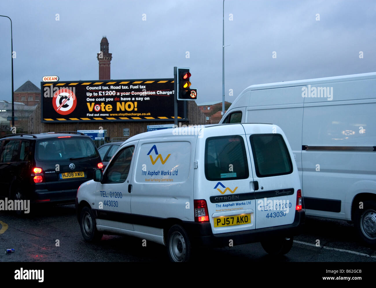 Traffic congestion,city centre, Manchester,UK. Manchester Prison (Strangeways) and 'Vote No to congestion charge' poster beyond. Stock Photo