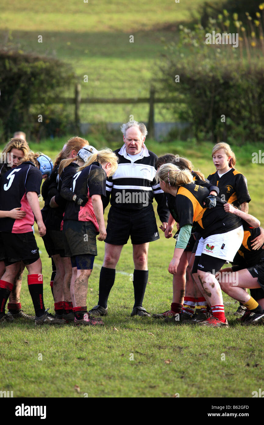 Teenage girls playing Rugby on a cold wet autumn afternoon Stock Photo ...