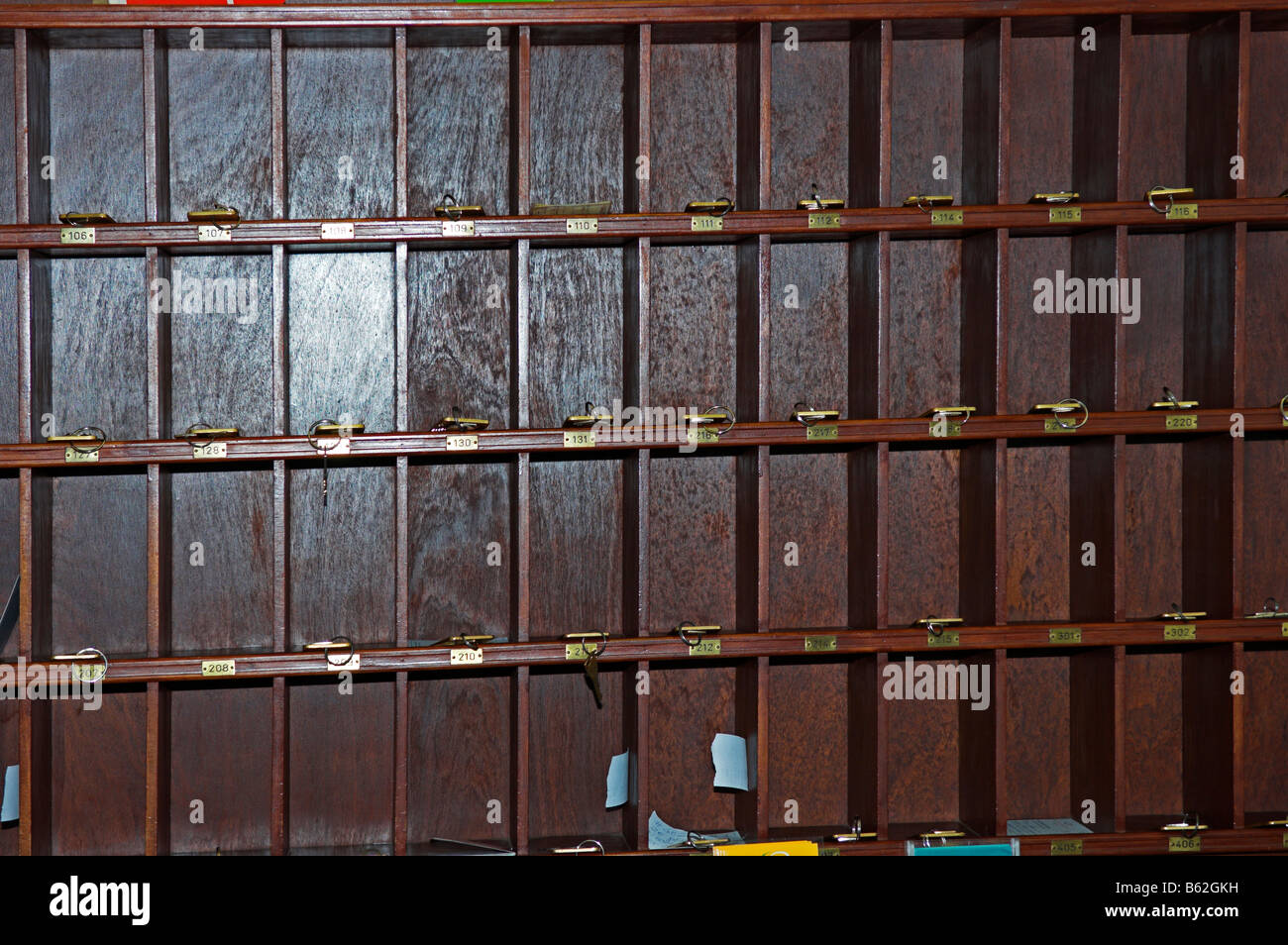 Old traditional wooden hotel room 'pigeon holes' for keys Stock Photo