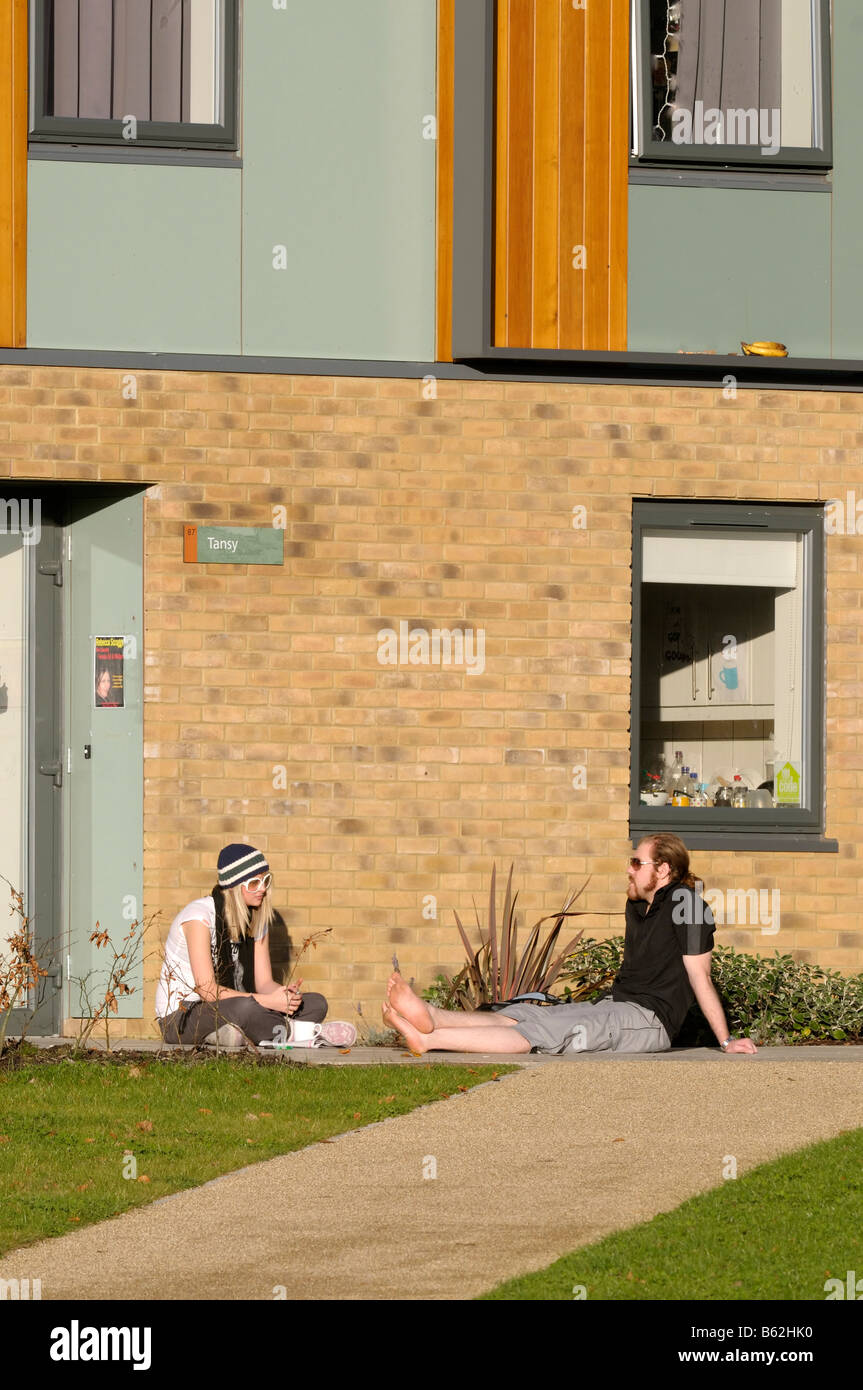 Students relaxing outside a residence building at Lancaster University Stock Photo