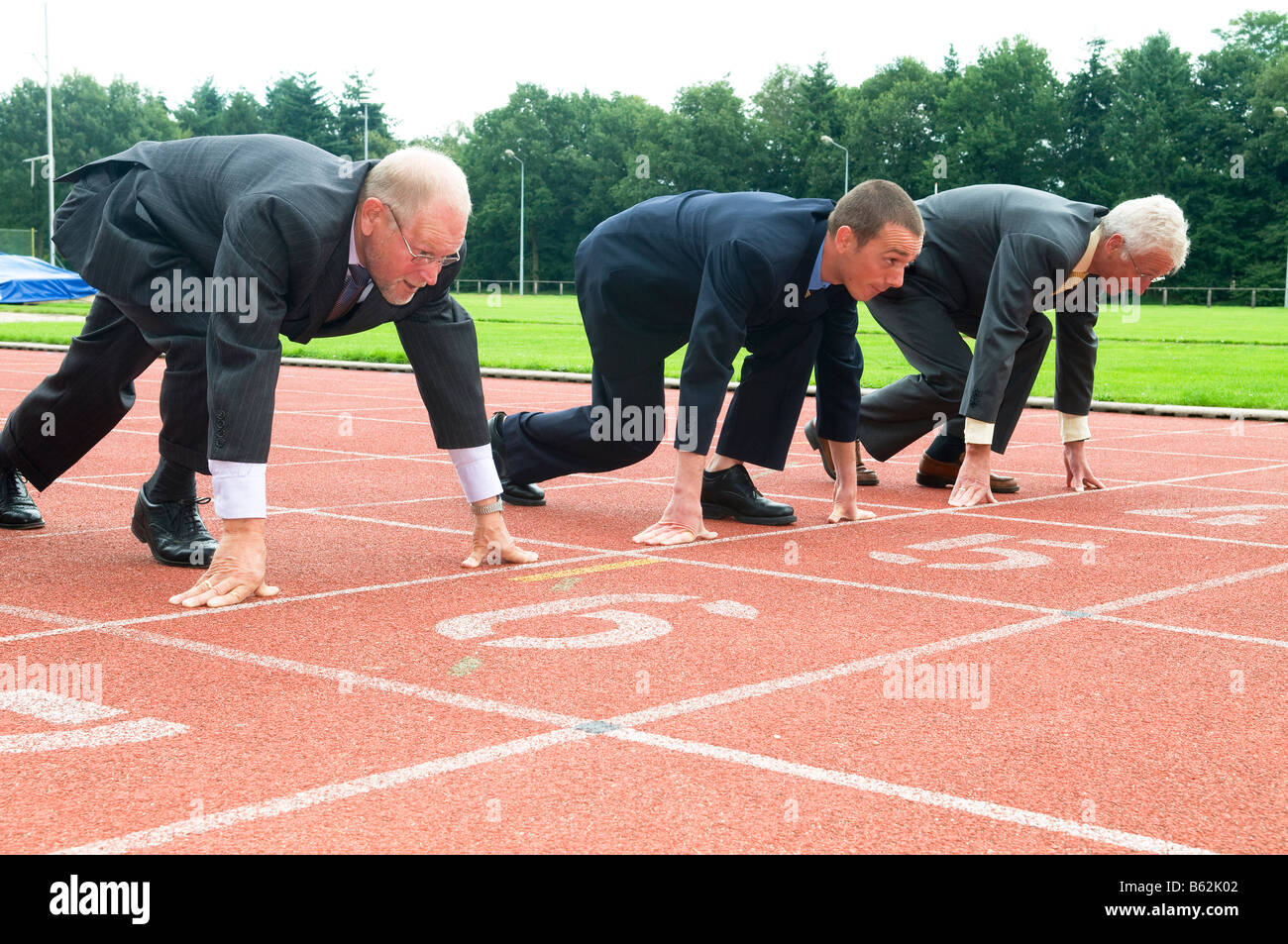 Loading Ready Run Team Group of businessmen are ready for the start of the run Stock Photo - Alamy