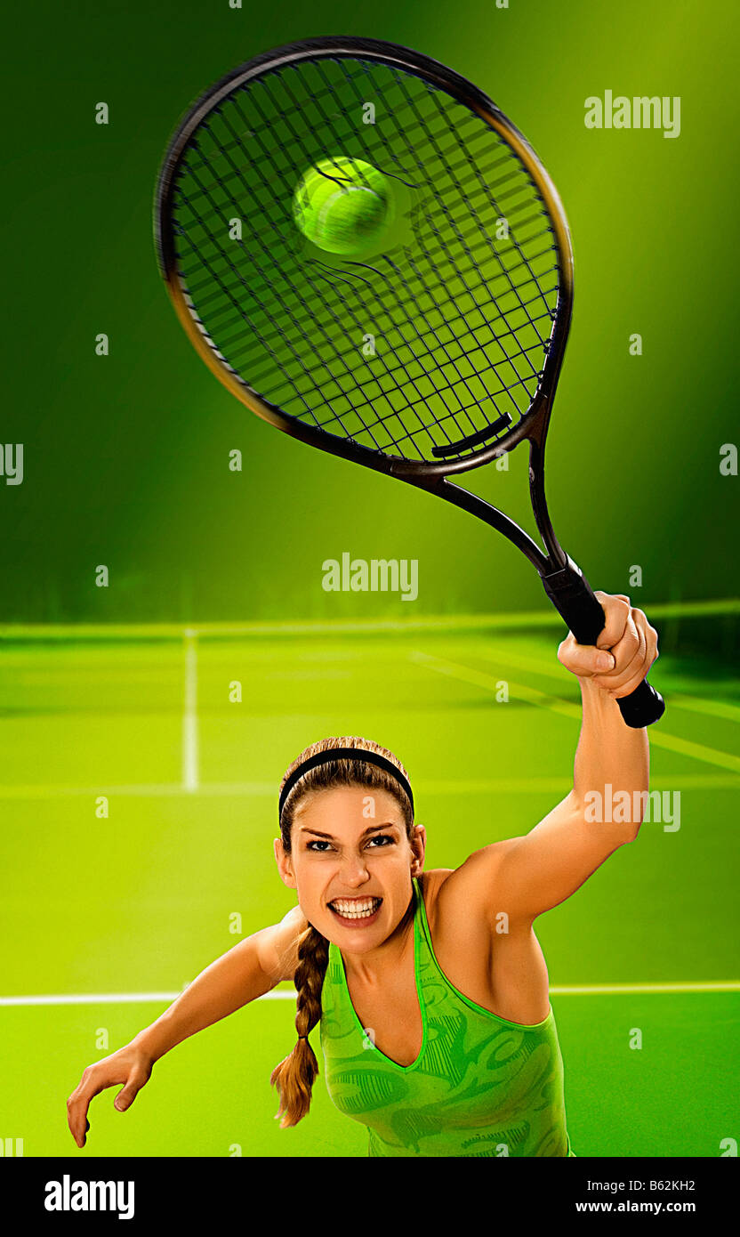 Young woman hitting a tennis ball Stock Photo Alamy