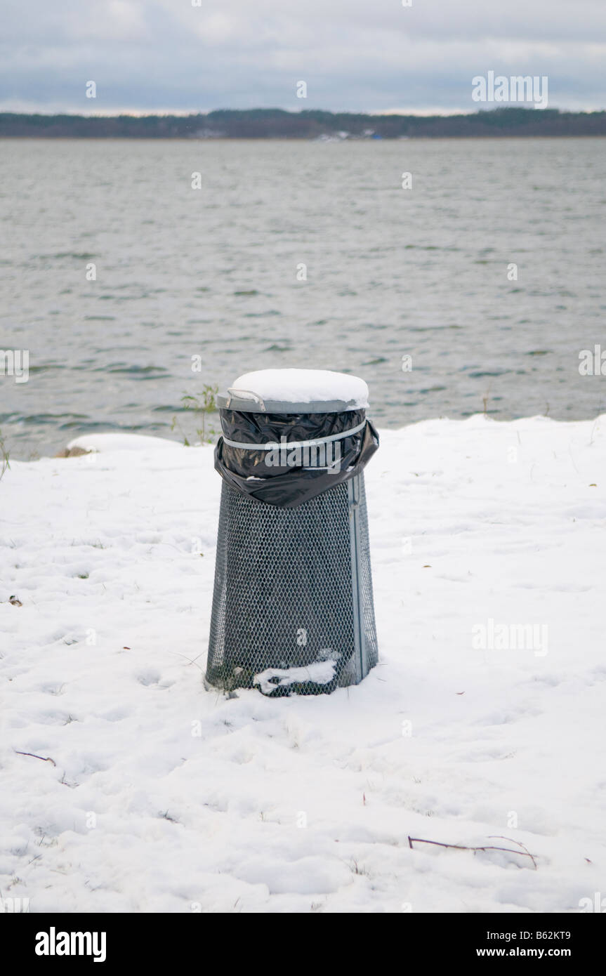 Garbage can in the snow. Stock Photo