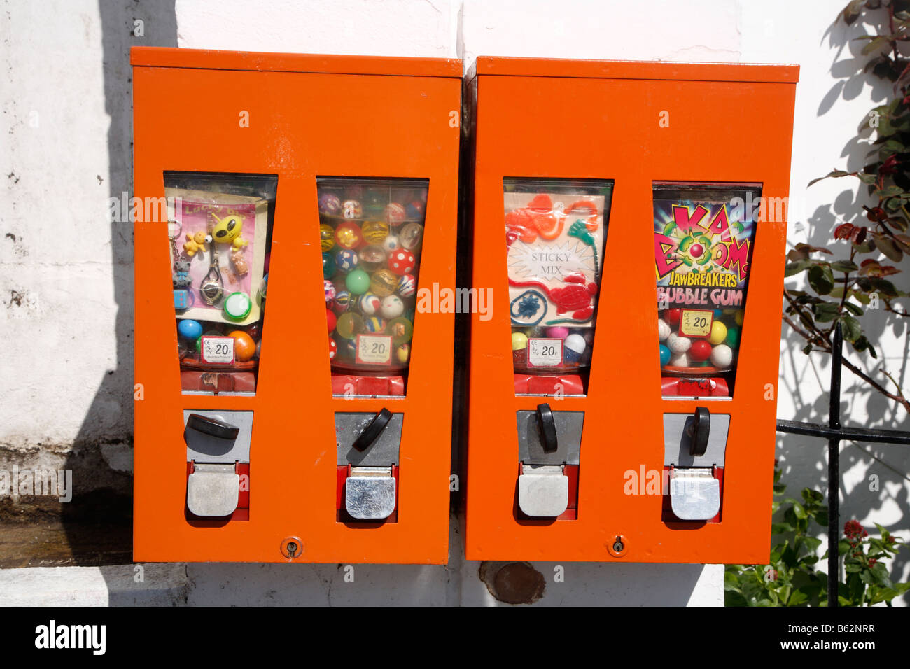 Kids bubblegum sweets and small toys vending machine. Stock Photo
