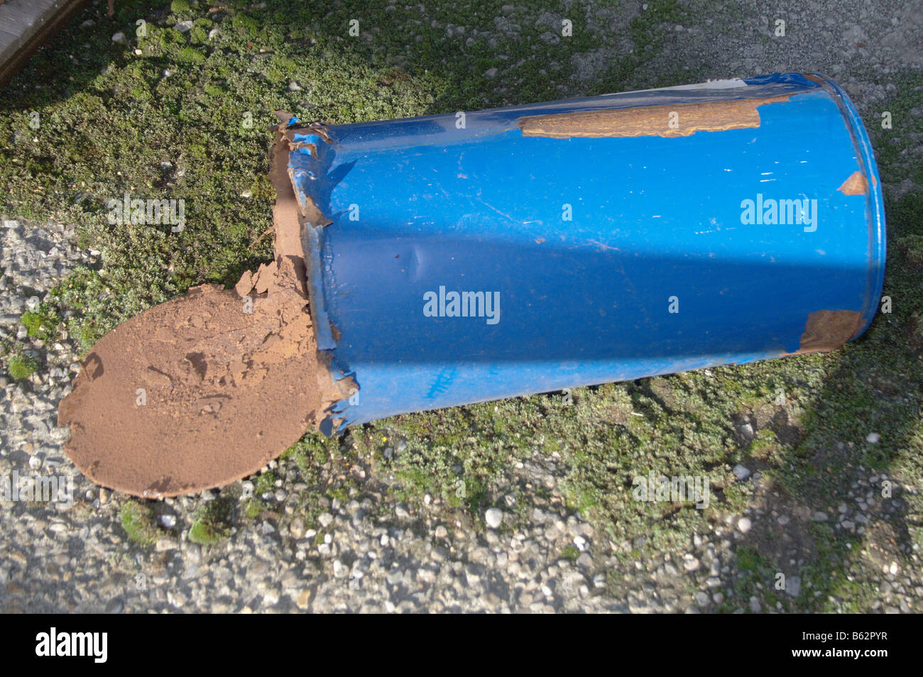 Rusting cans leaking solvent Stock Photo Alamy