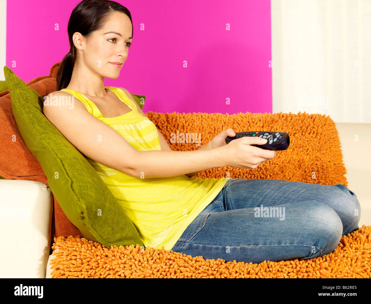 Young Woman Watching Television Model Released Stock Photo