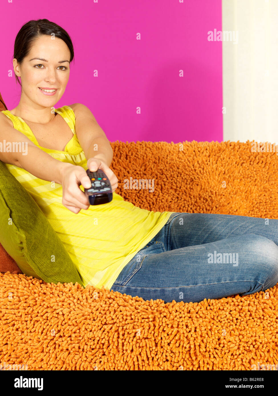 Young Woman Watching Television Model Released Stock Photo