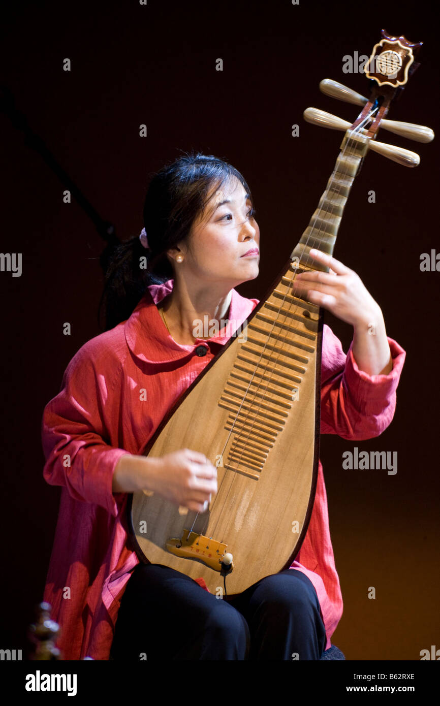 Wu Man, musician of the Silk Road ensemble, performing on the pipa at the inauguration of the Museum of Islamic Art, Doha, Qatar Stock Photo