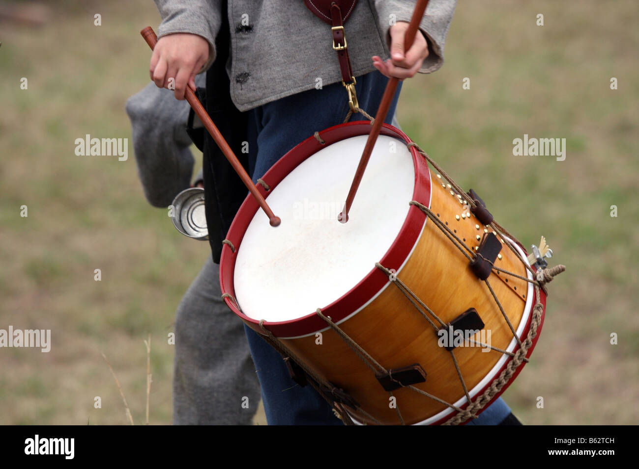 A drummer boy drumming the march during the battle at a Civil War Reenactment at the Wade House Greenbush Wisconsin Stock Photo