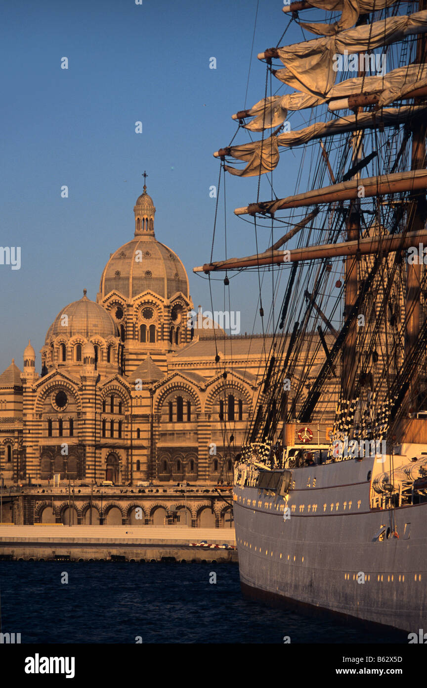 The Cathedral of the Nouvelle Major and the masts and rigging of the Russian tall ship 'Sedov', in Marseille harbour, France Stock Photo