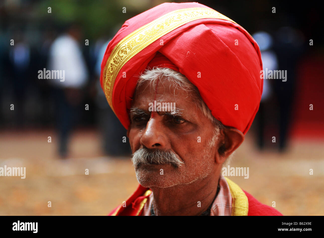 Royal servant acting as refree in a wrestling match during Mysore Dasara festival in 2008. Stock Photo