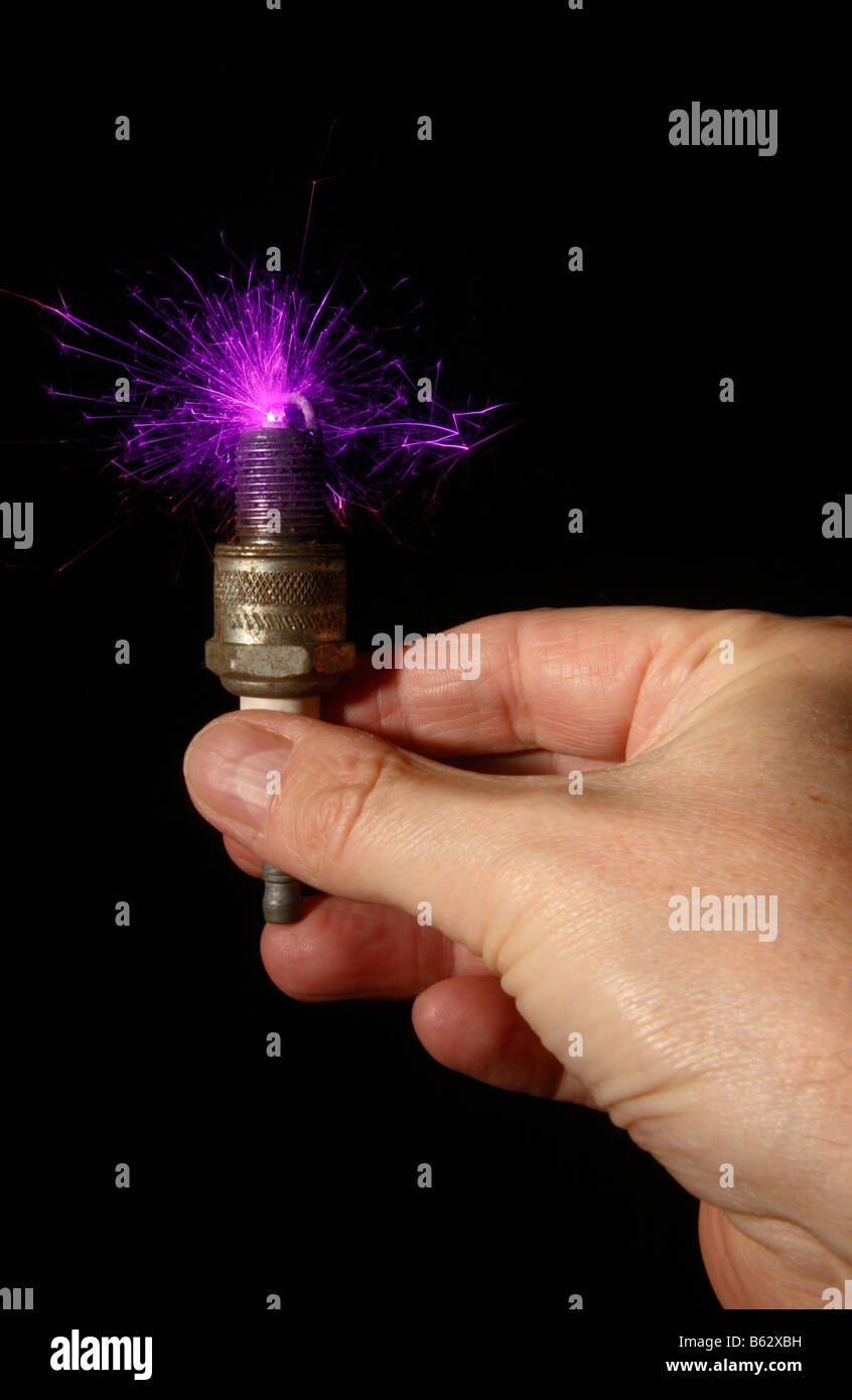 A hand held sparking plug, still full of energy. Stock Photo