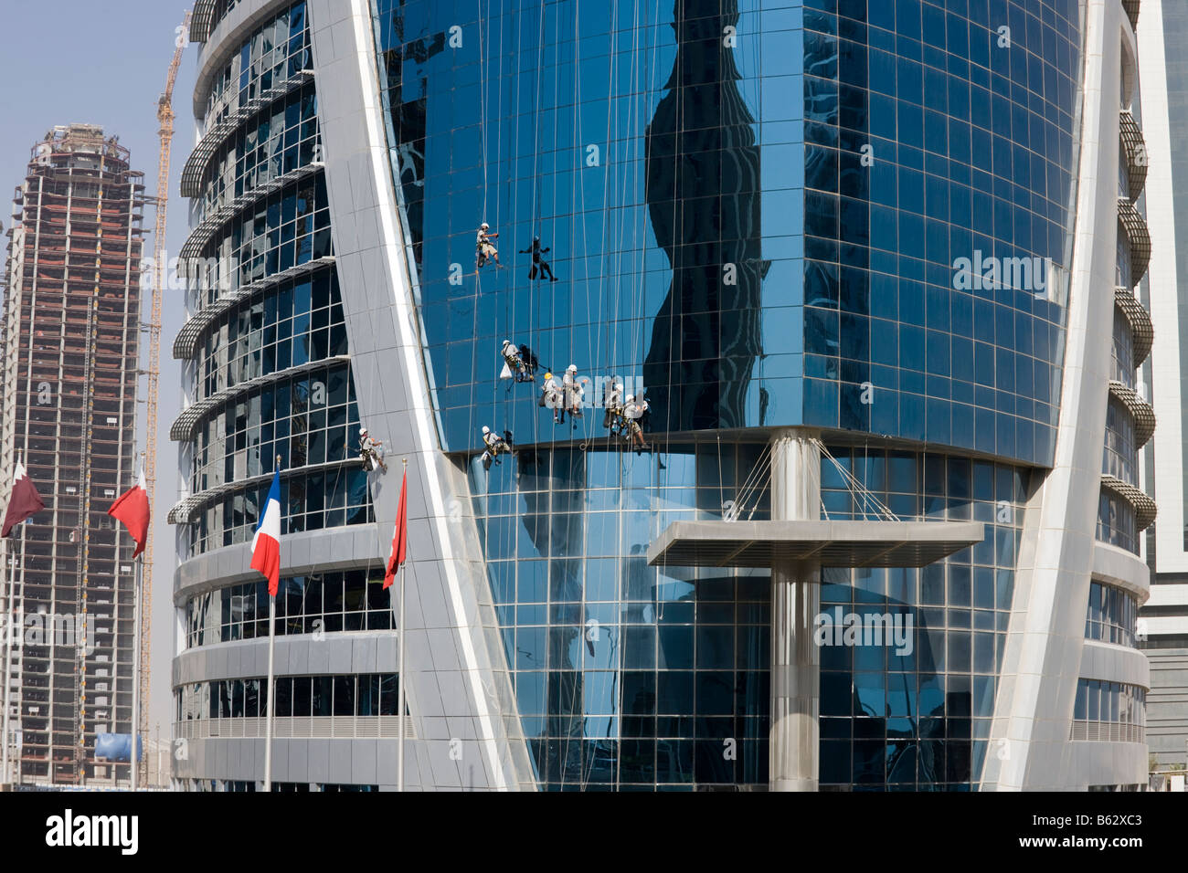 window cleaners on outside of Doha Tower Qatar Stock Photo