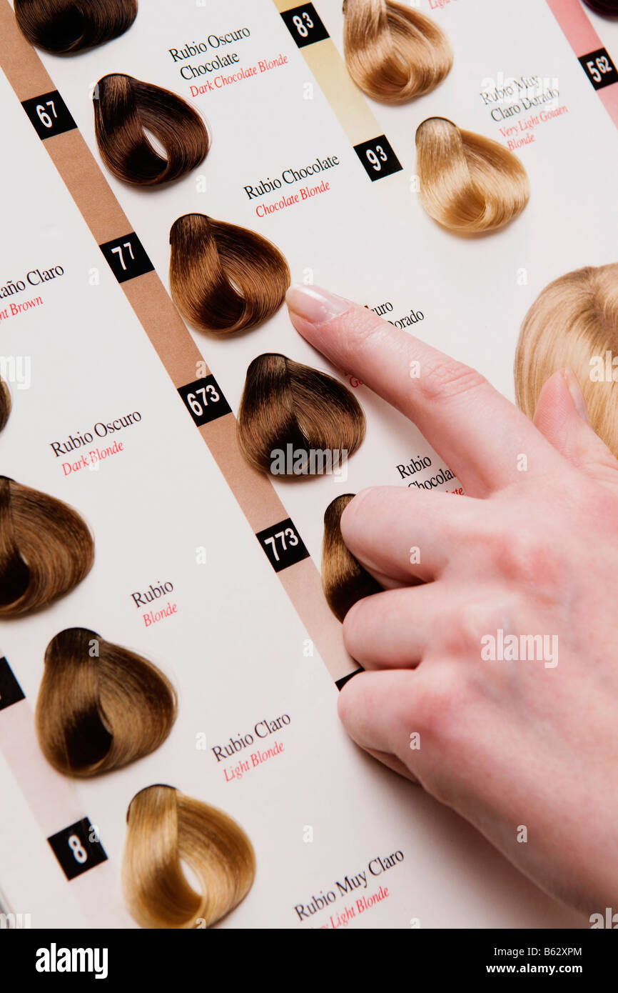 Woman choosing a hair color from a color swatch Stock Photo