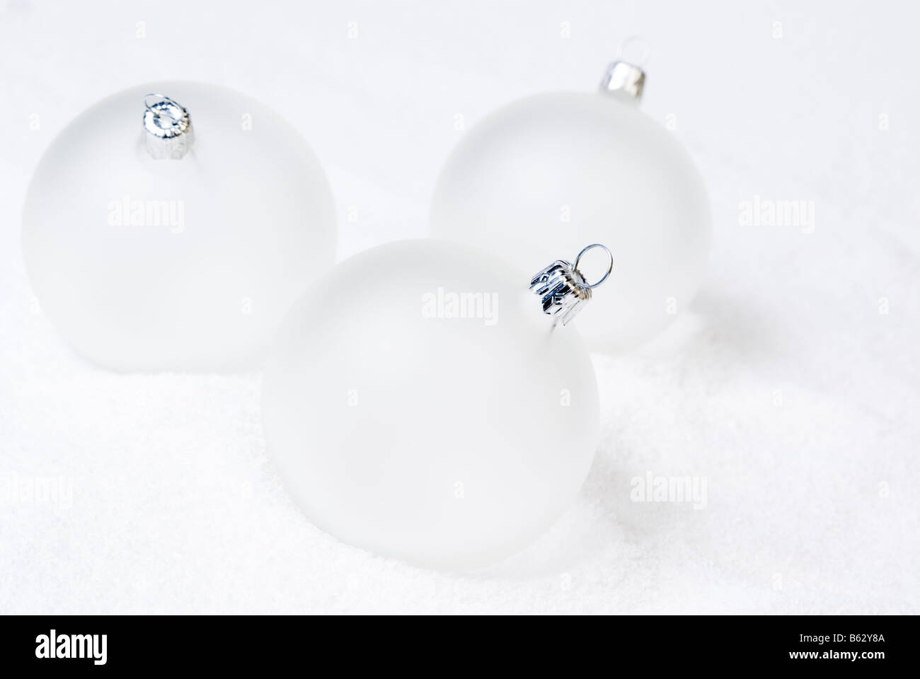 Christmas balls on the snow. High key, aRGB. Stock Photo