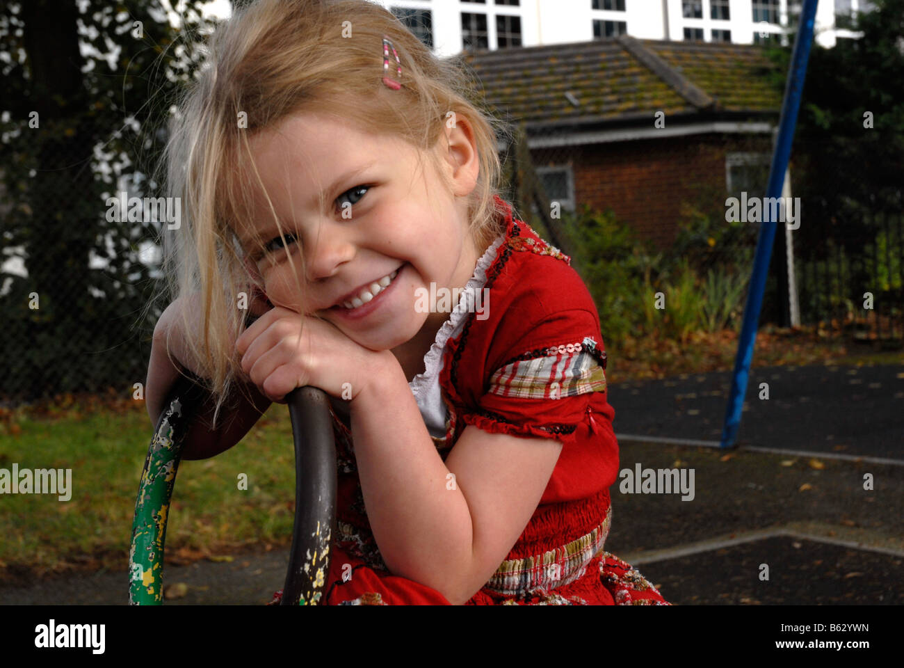 Portrait of a little girl in a playground Stock Photo - Alamy
