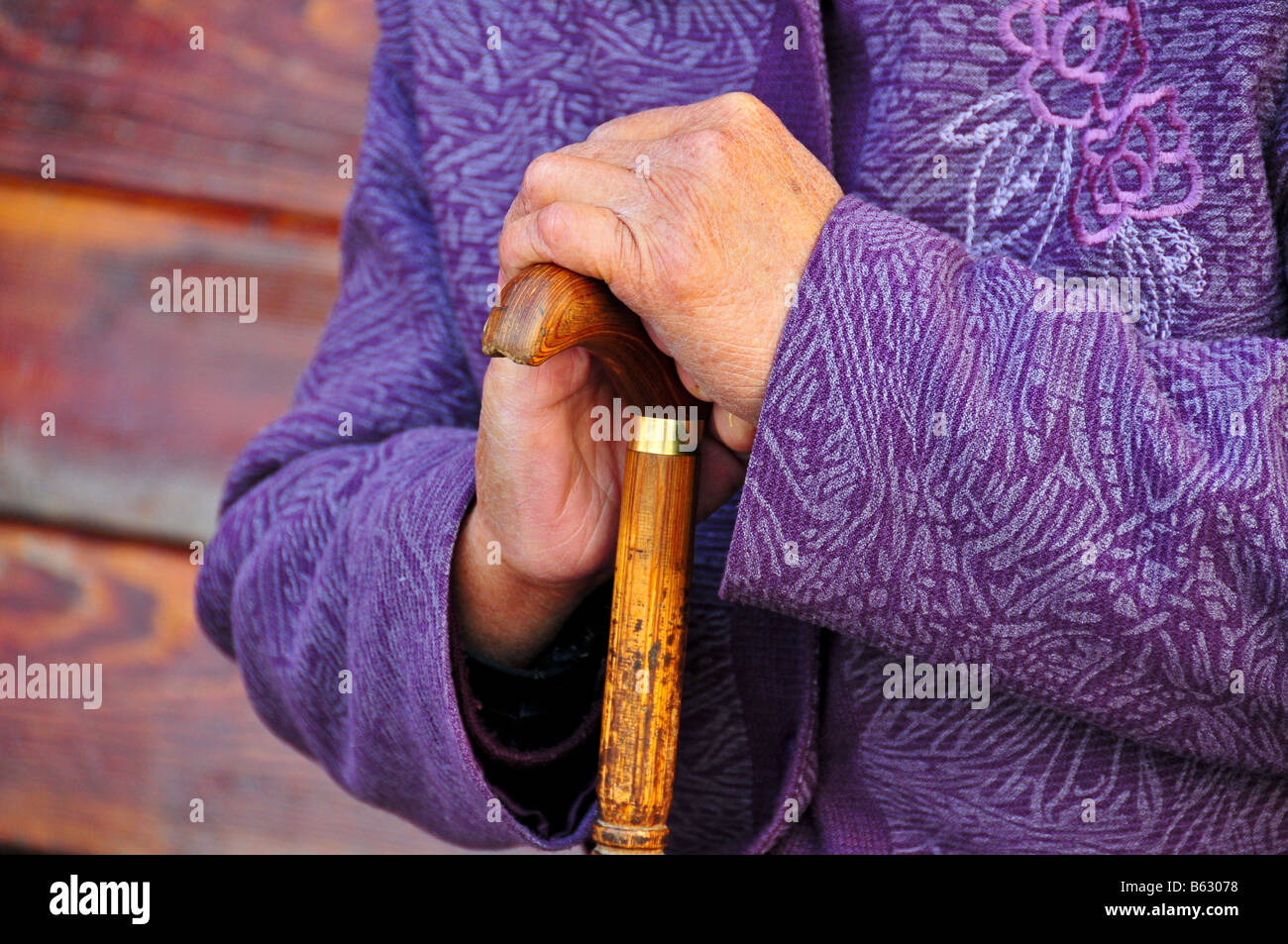 Elderly Woman Holding a cane Stock Photo