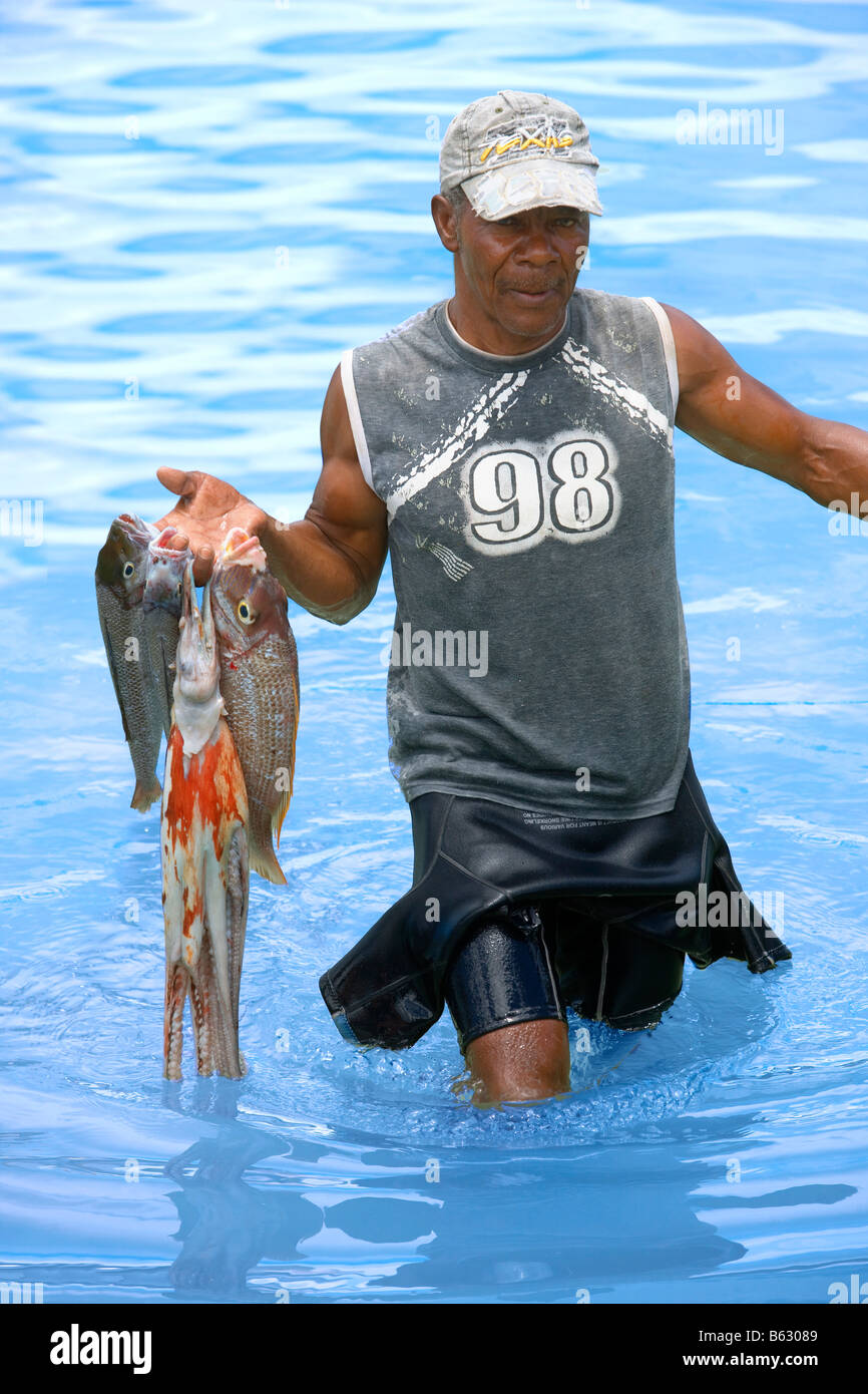 Fisherman fishing fish seychelles hi-res stock photography and