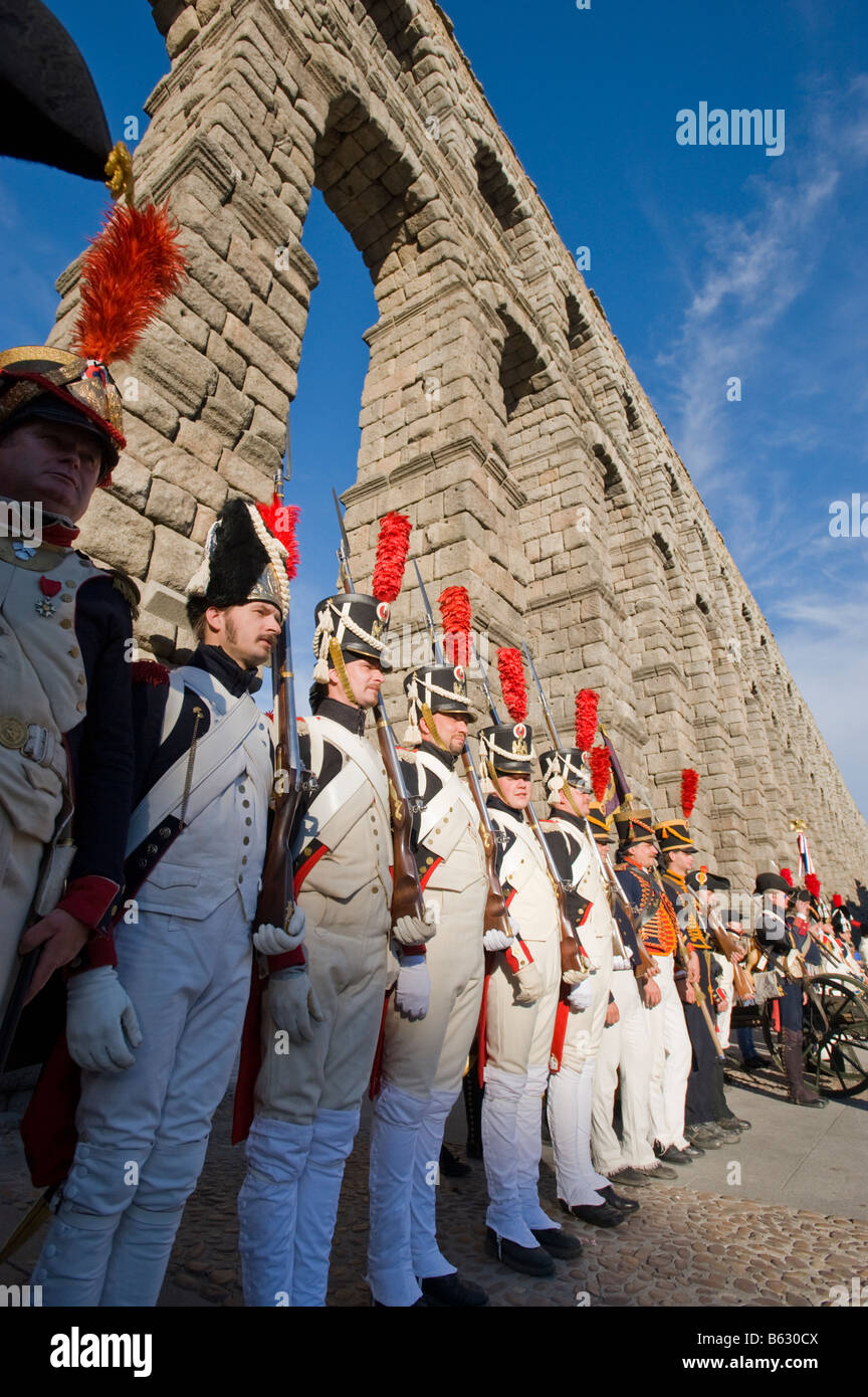 Men dressed up in old military costumes at the Roman Aqueduct in Segovia, Spain. Stock Photo