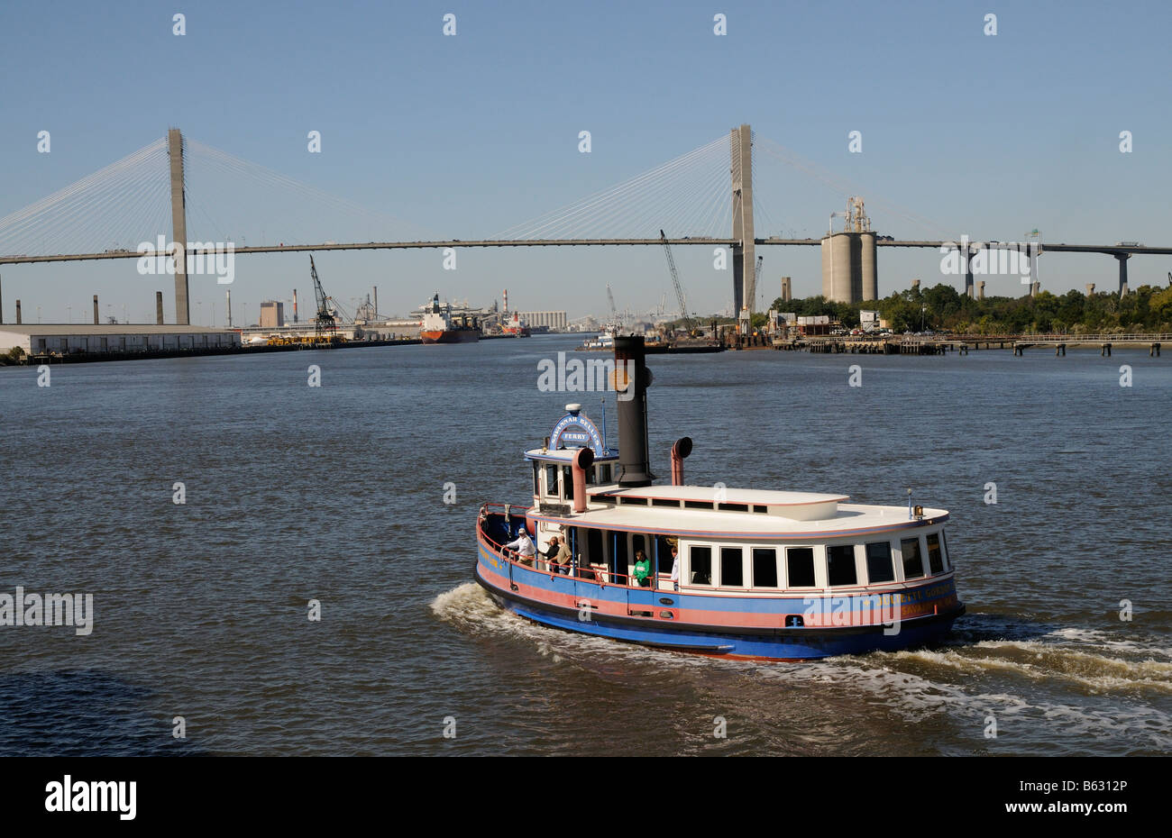 Ferry crossing the Savannah River America USA and road bridge