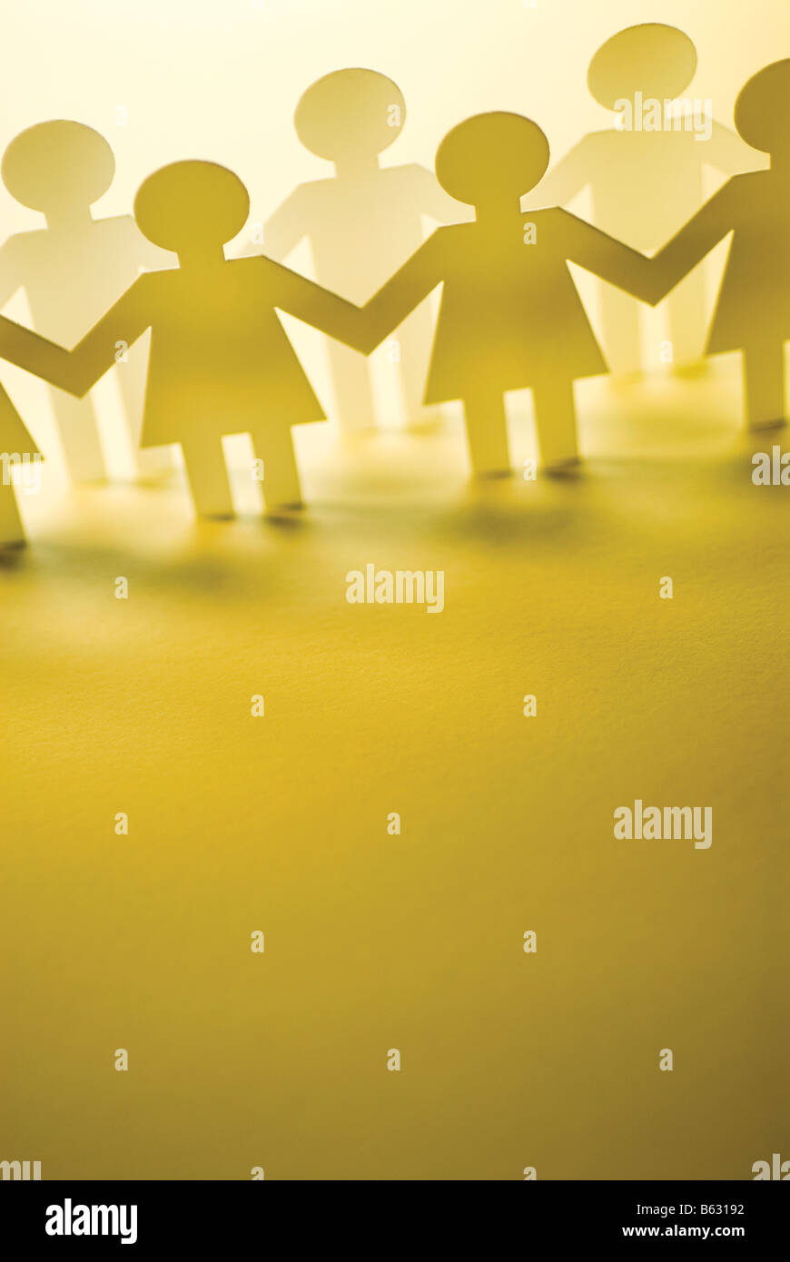 Paper dolls holding hands hires stock photography and images Alamy