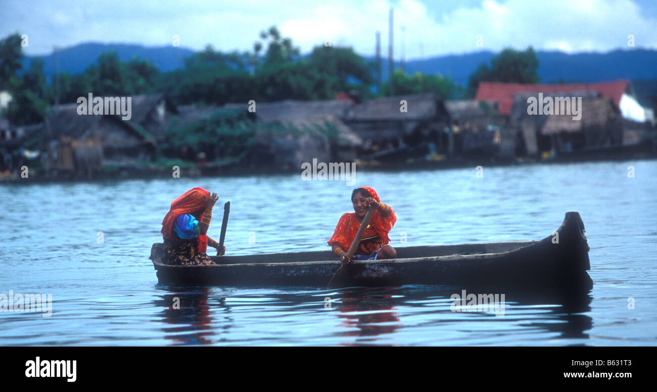 Two Kuna women in a traditional boat in the caribbean Stock Photo