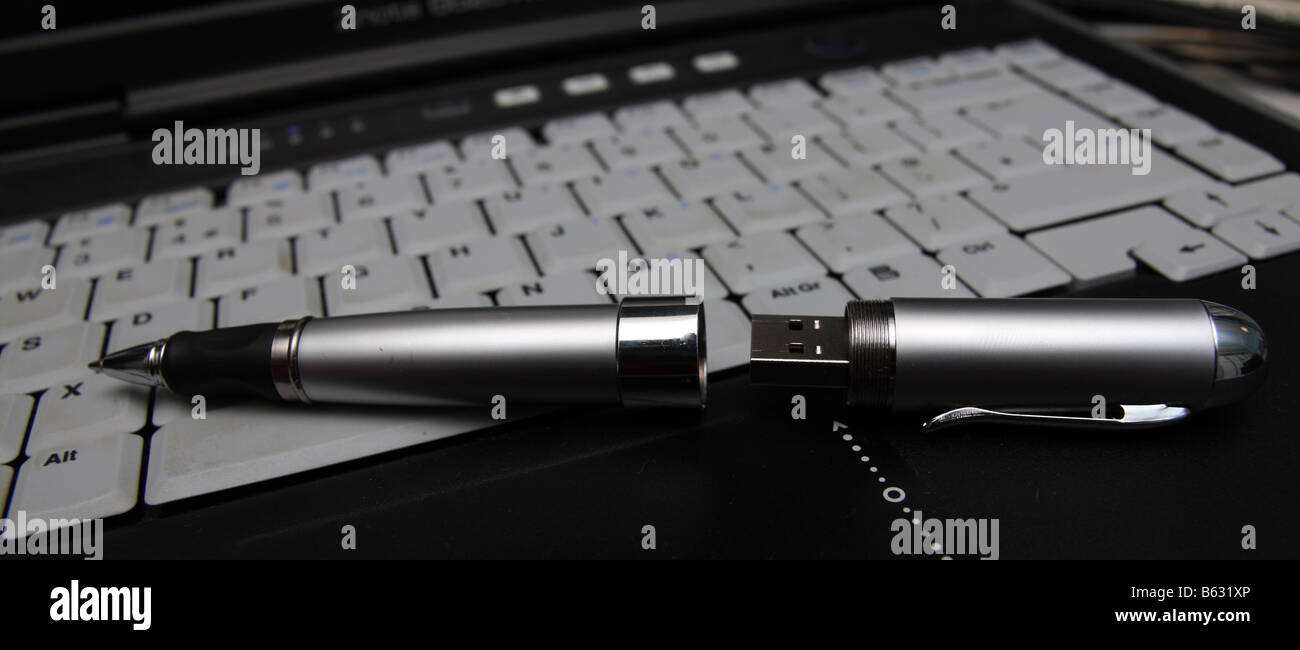 True pen drive on laptop keyboard Stock Photo
