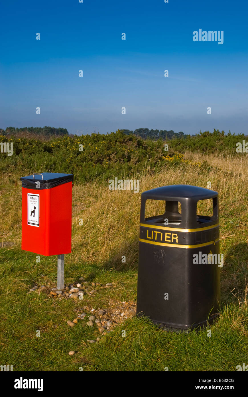 Litter bin and dog poo bin for dogs mess in countryside car park in the
