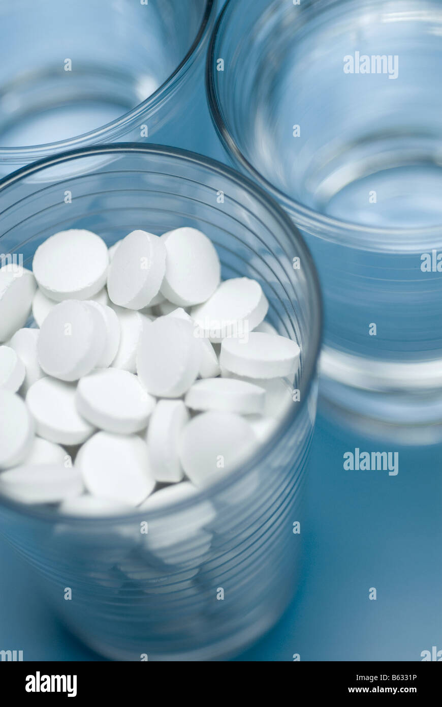 Close-up of glasses of water and pills Stock Photo