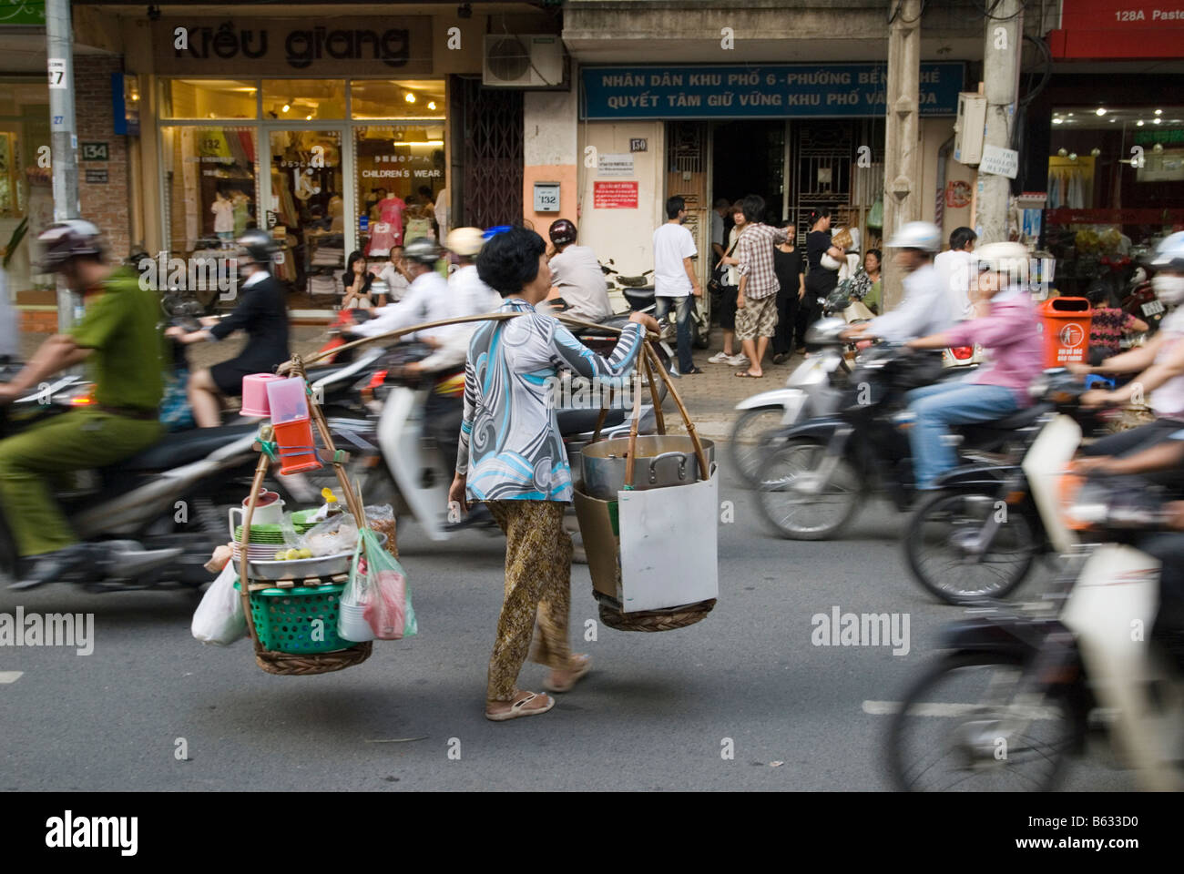 HOCHIMINH CITY, VIETNAM - Feb 24, 2017: People Cross The Road In