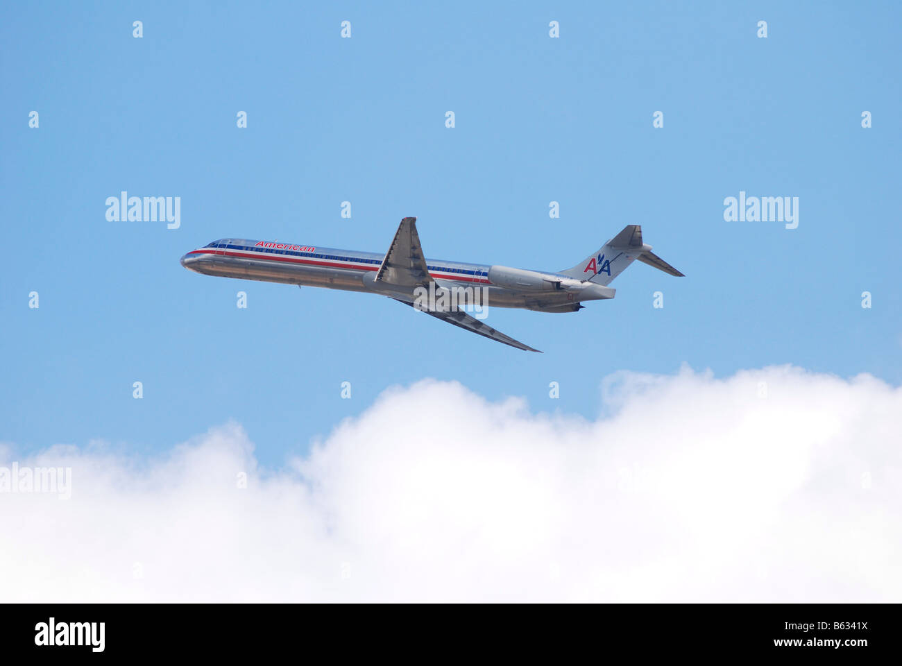 American Airlines Jet airplane flying above the clouds Stock Photo