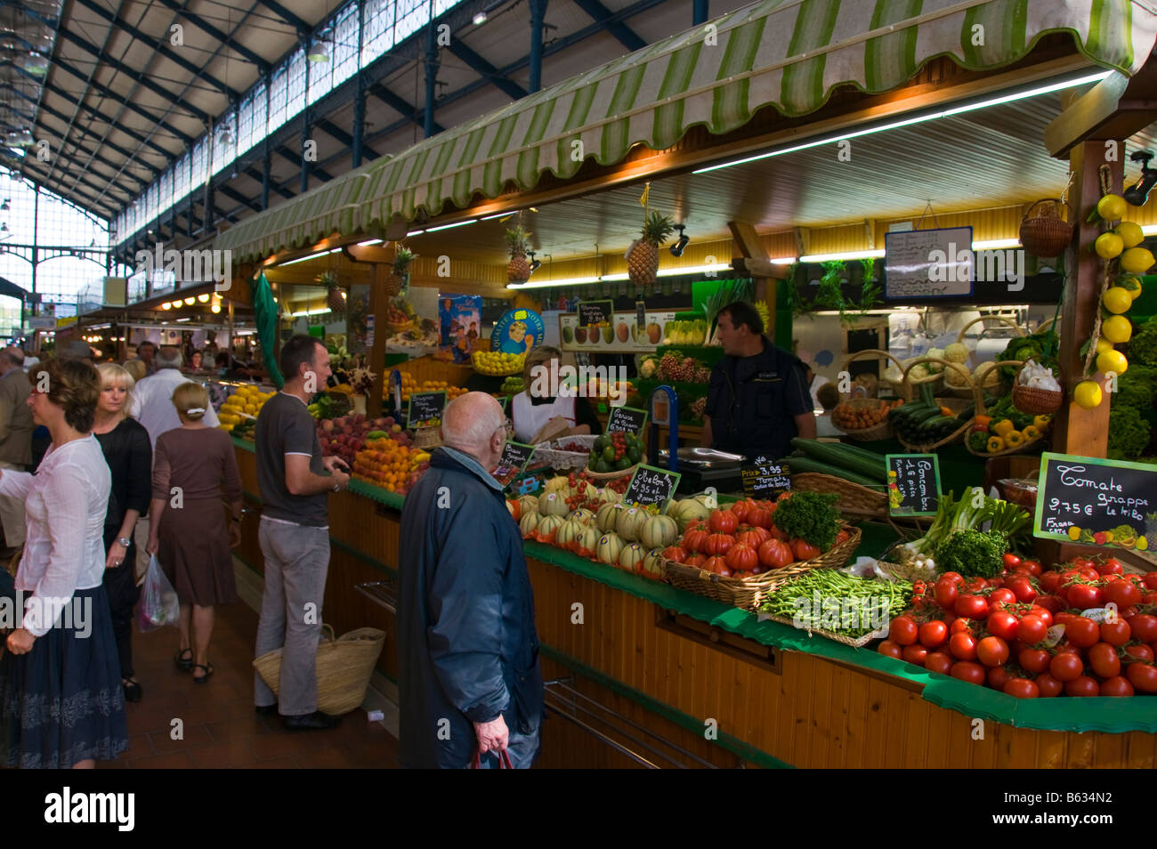 Fruit and vegetable stall at the covered market of Niort Deux Sèvres France Stock Photo