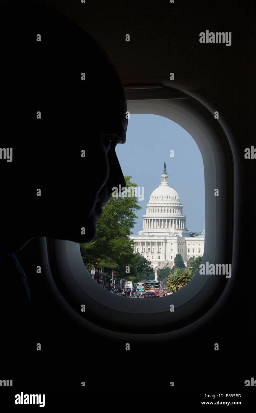 Passenger looking at a building through the window of an airplane, Capitol Building, Washington DC, USA Stock Photo