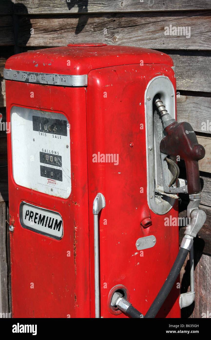 An antique gas pump next to a wharf building in Branson Missouri Stock