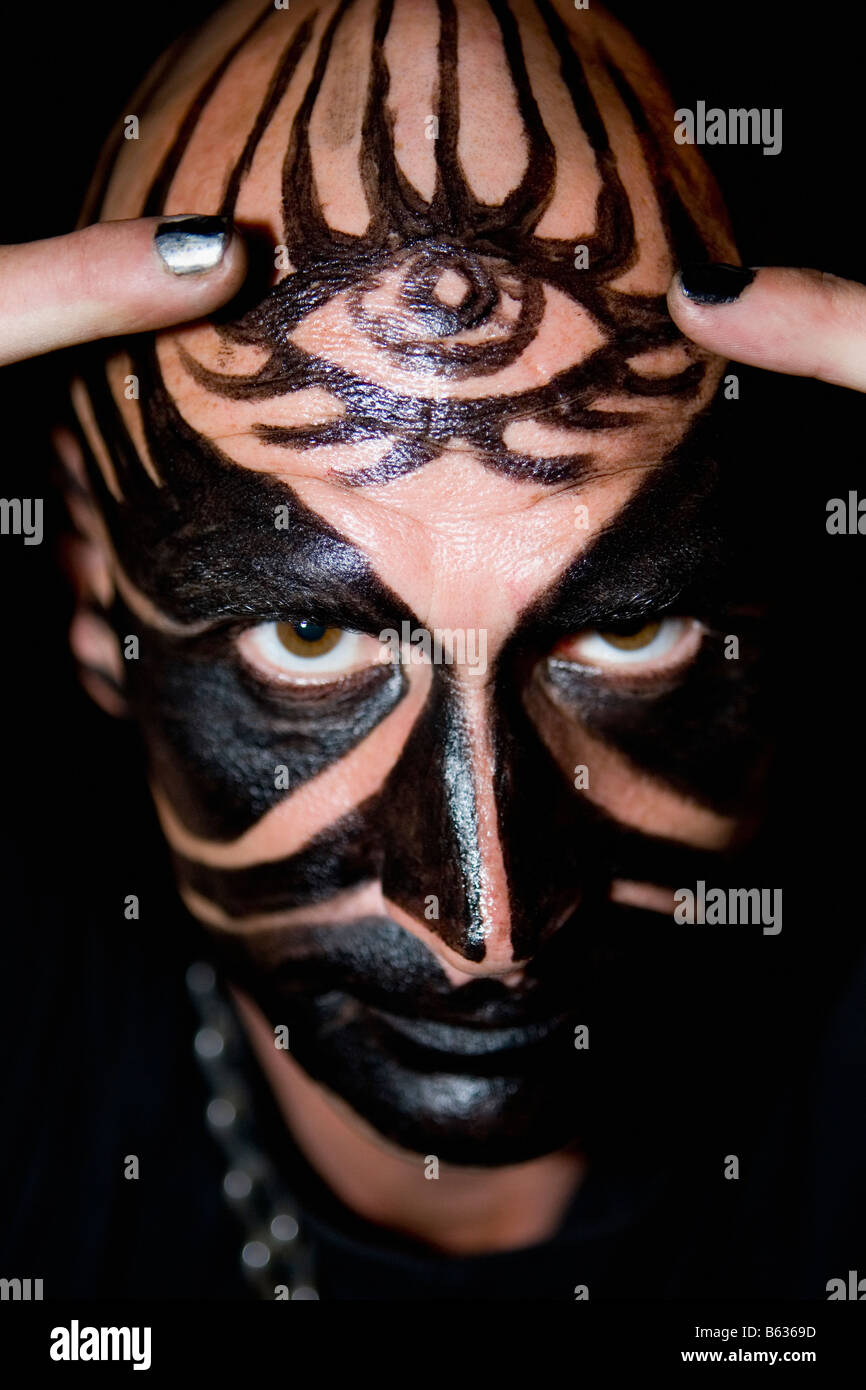 Portrait of a mid adult man with face paint on his face Stock Photo - Alamy