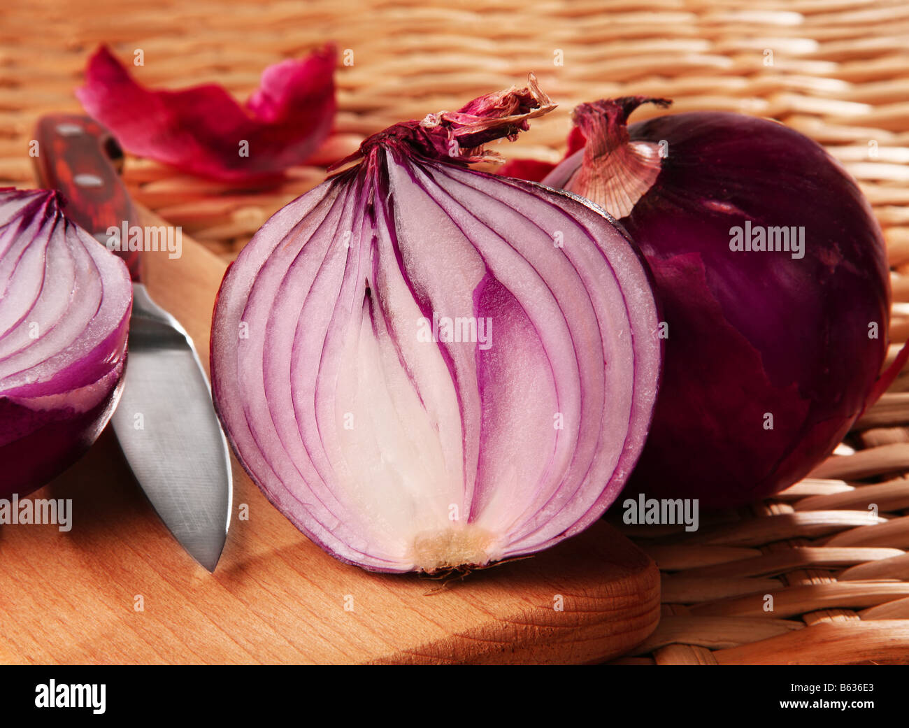 Violet ripe onion detail with slice on background Stock Photo
