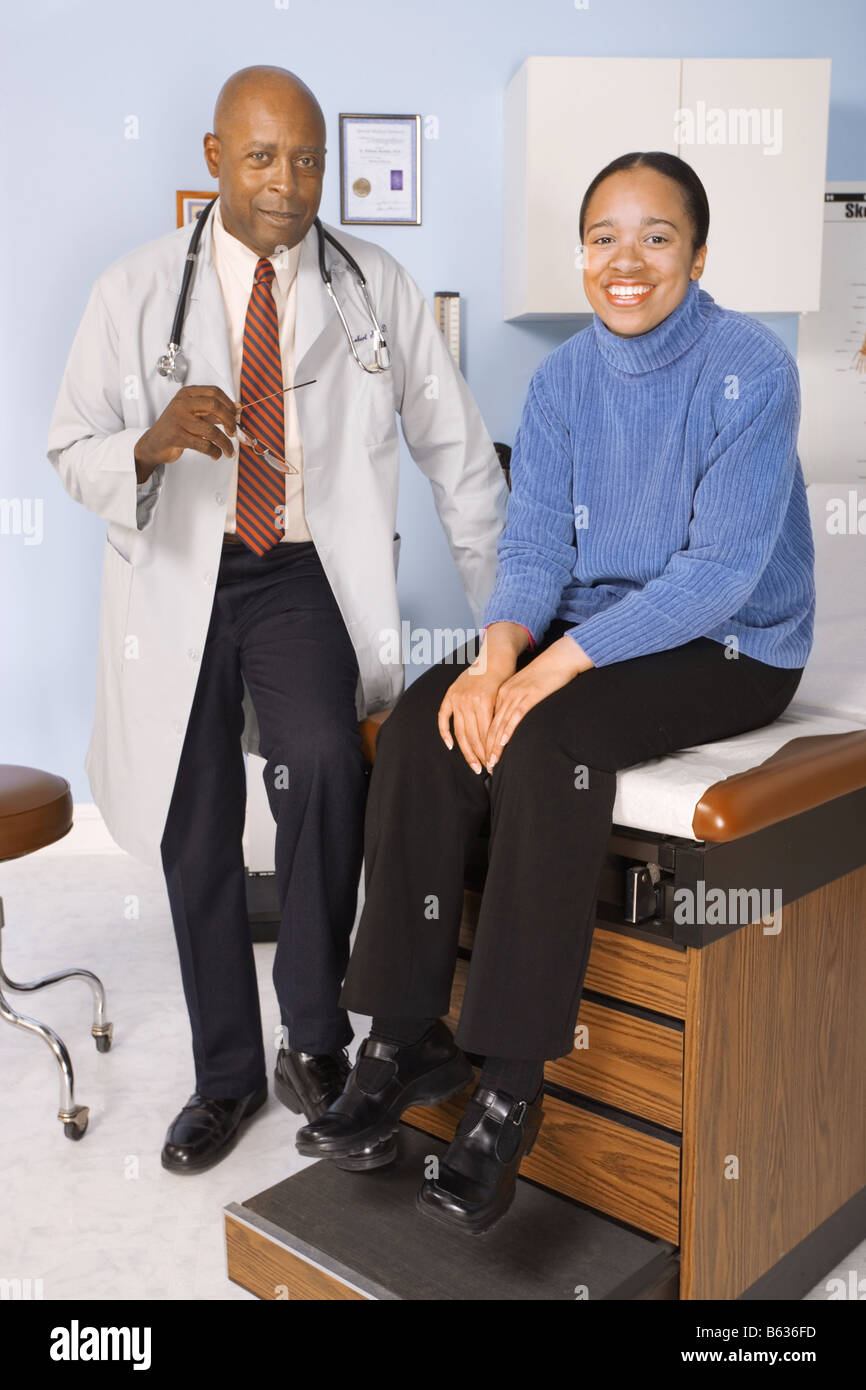Female patient with her doctor in the exam room Stock Photo - Alamy