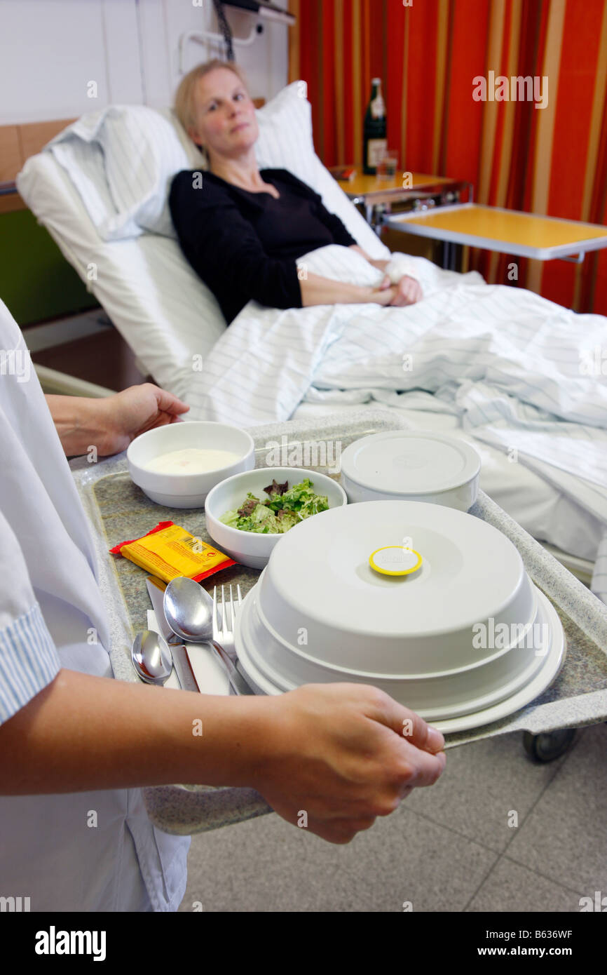 Nurse serves lunch for a patient in a hospital Stock Photo Alamy