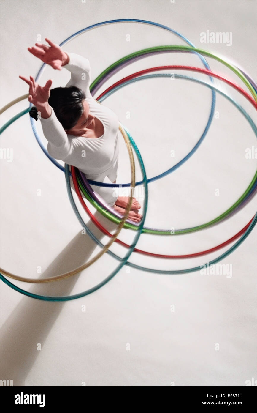 High angle view of a mature woman exercising with hula hoops Stock Photo
