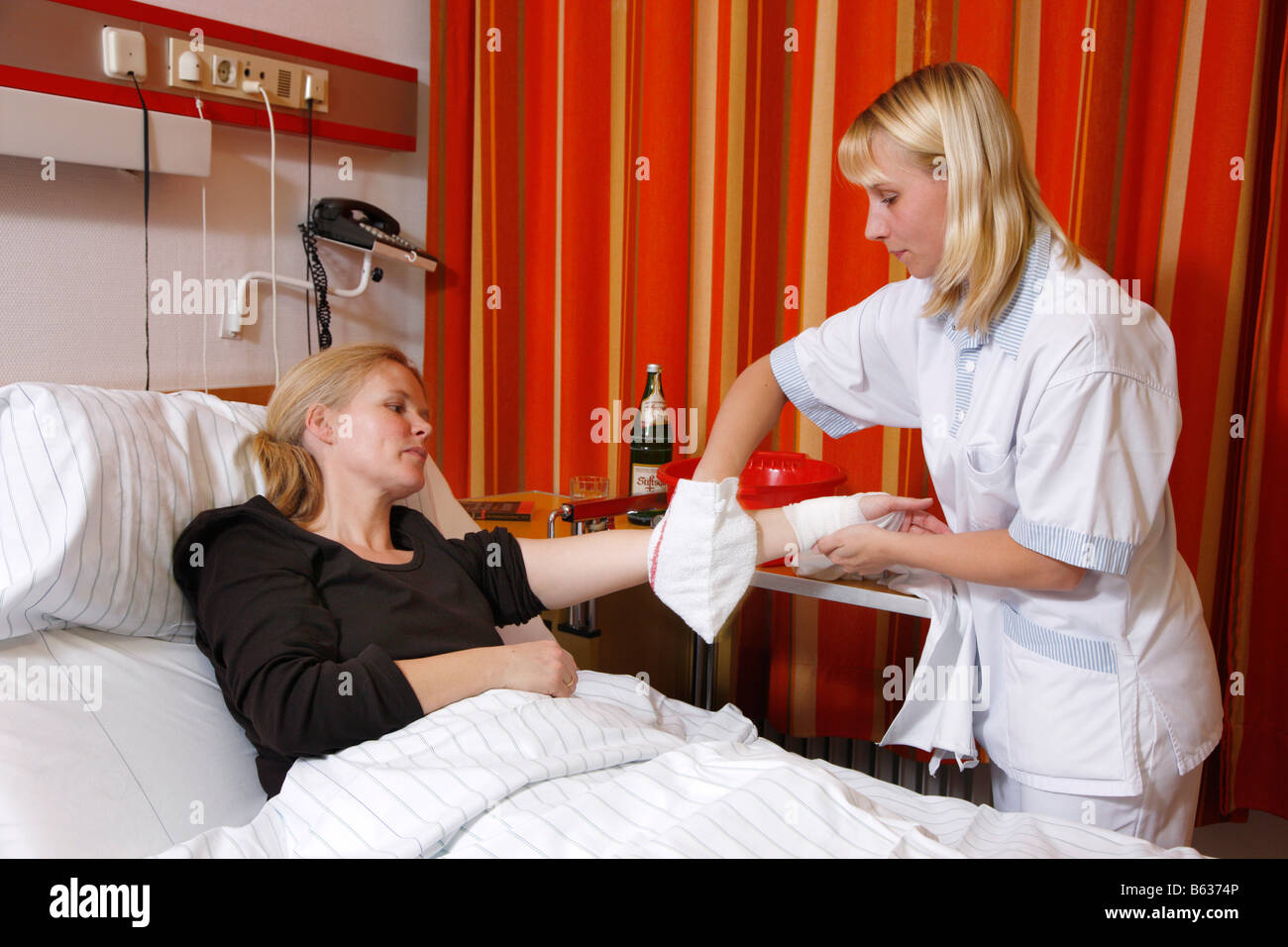 Nurse is washing a patient in a hospital Stock Photo Alamy