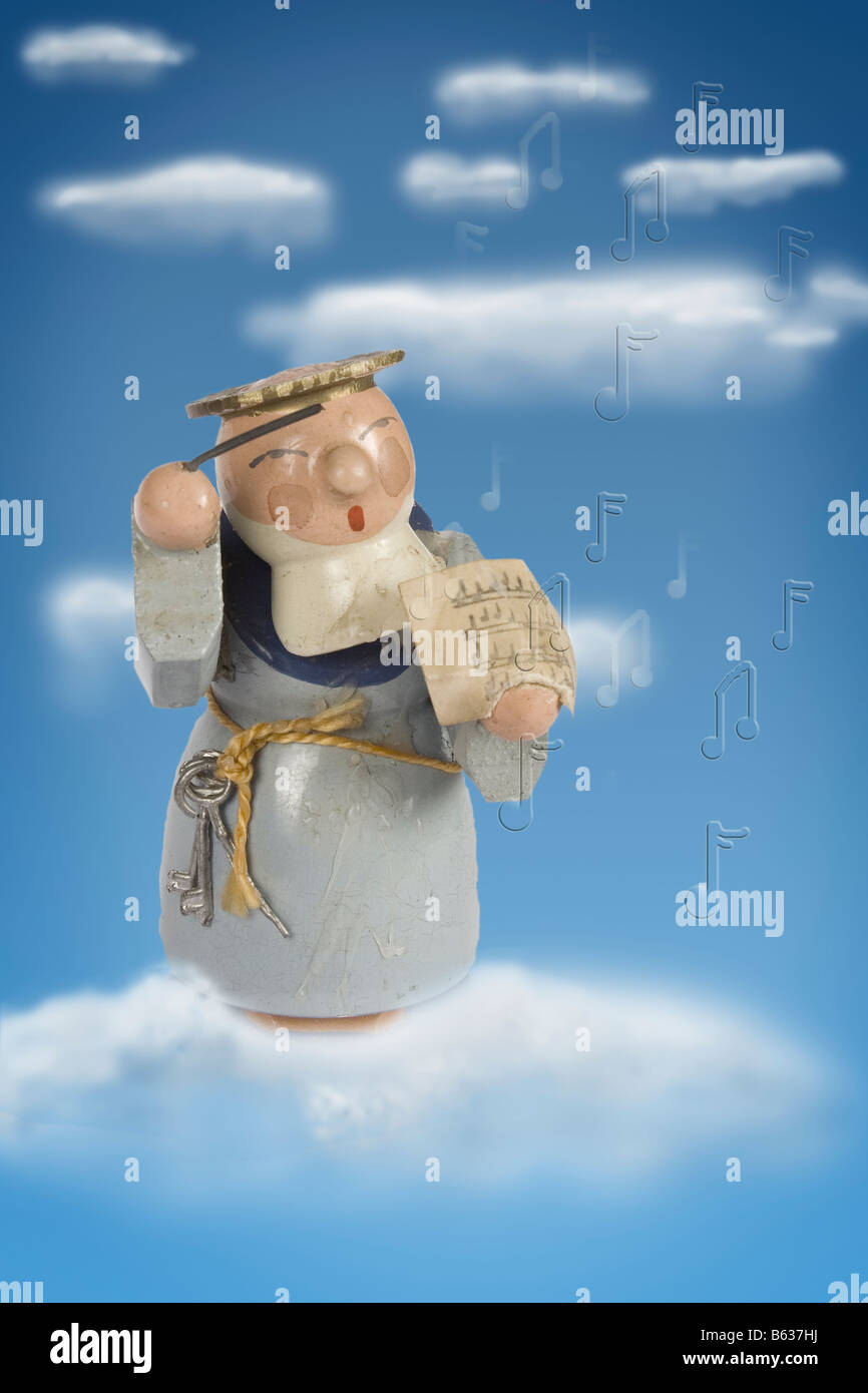 antique Christmas decoration ornament angel traditional conductor music choir clouds sky arial dream cutout vintage wooden Stock Photo
