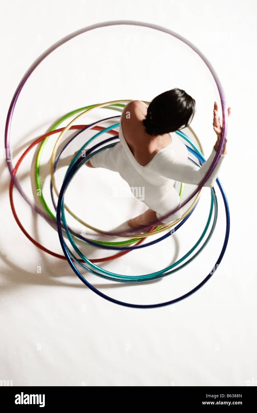 High angle view of a woman exercising with hula hoops Stock Photo