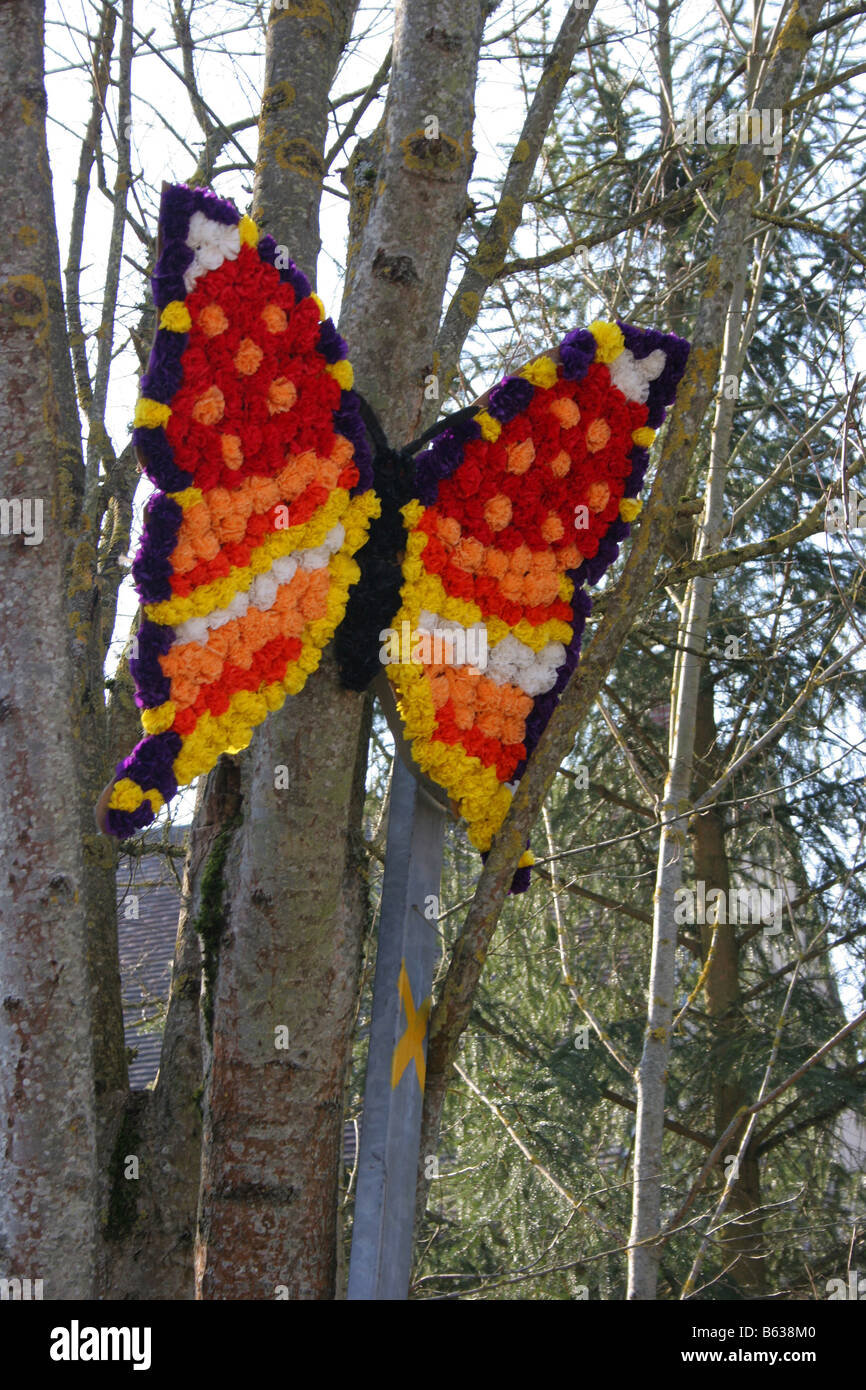 Orange Butterfly made of flowers, St Vincent festival, Villy near Chablis, Burgundy, France. Vertical  50558 Chablis2005 Stock Photo